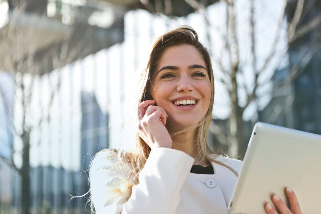 A white woman smiling as she makes a career shift.