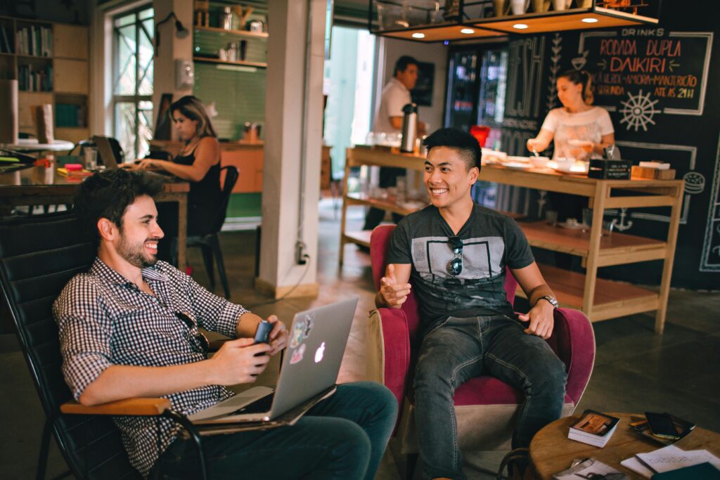 Two men making local connections at a coffee shop.